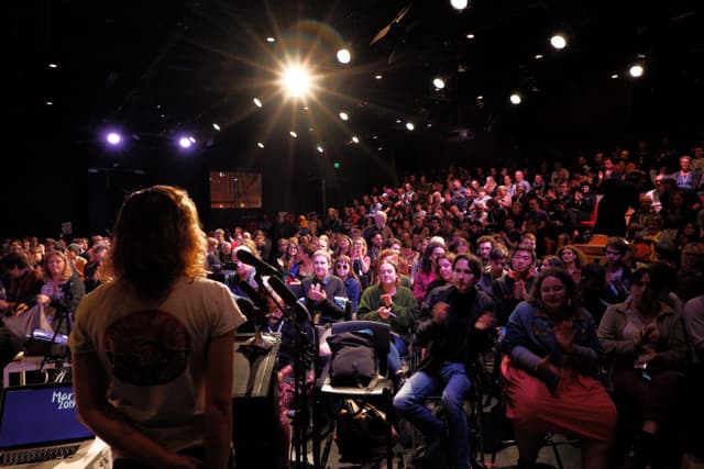 Cathy Lewis introducing a panel